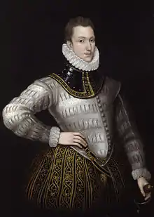 white man, clean-shaven with neat short hair, in Elizabethan dress