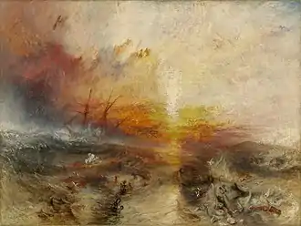 A painting entitled "The Slave Ship" by J. M. W. Turner. In the background, the sun shines through a storm while large waves hit the sides of a sailing ship. In the foreground, slaves are drowning in the water, while others are being eaten by large fish