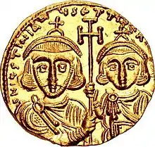 A picture of a gold coin, bearing an image of Tiberius IV and his father Justinian II on its reverse side.