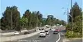 Southern Cross Drive, southerly direction, at the Link Road entrance. Also visible are lane markings notifying motorists of the approaching entrance to Eastern Distributor