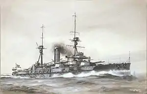 A large gray warship bristling with guns creates a large bow wave as it plows through choppy seas.