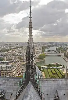 The 13th century flèche of Notre Dame, recreated in the 19th century, destroyed by fire in 2019, now being restored