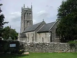 Gray stone building with square tower