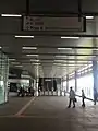 The common concourse of the Sungai Buloh KTM and MRT Station, with the fare gates into the MRT station directly ahead.