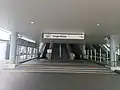 Escalator and stairs at Entrance A of station.