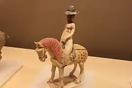 Woman rider wearing a tanling ruqun and a humao, Horse and female rider, Tang dynasty.: 291 