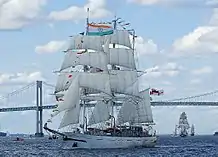 Tarangini passing under the Claiborne Pell Newport Bridge - Narragansett Bay, Rhode Island, US - followed by the Prince William and Picton Castle.