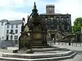 The Cross Well at Linlithgow, modelled on the courtyard fountain of Royal palace, substitutes for the town's demolished cross