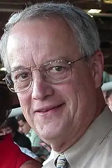 head shot of smiling man in his sixties