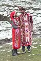 Tourists posing in traditional Kullu attire, at Solang valley