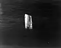 The bow of USS Fiske floating in the North Atlantic after she was broken in two by a torpedo from the German submarine U-804 on 2 August 1944. This section had to be sunk by gunfire. Photographed from an airplane based on USS Wake Island; note the sonar dome on Fiske's keel.