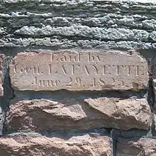 Cornerstone of South College of the Old Mill, installed by General Lafayette.