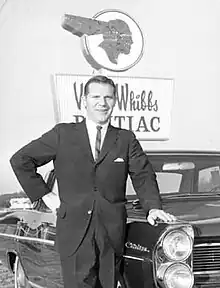 Whibbs portrait in front of Vince Whibbs Pontiac Dealership