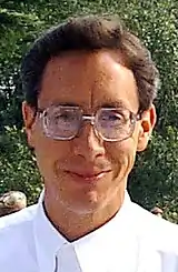 A smiling, bespectacled Warren Jeffs