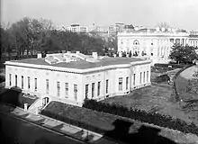 Expanded West Wing, circa the 1910s. President President Taft's 1909 expansion covered most of the tennis court. Note the "bow" of the first Oval Office.