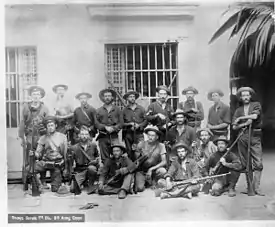 Picture of Young's Scouts in the Philippines, including Marcus W. Robertson 2nd from right front, squatting.